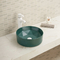 Gładka ceramiczna okrągła umywalka łazienkowa nad blatem stołu pomarańczowa umywalka